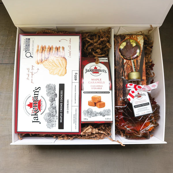 Open anniversary maple gift box with assorted maple caramels, cookies, and candies