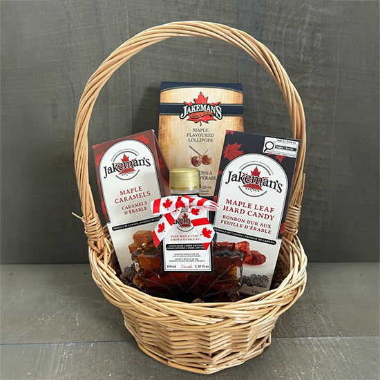 Wicker maple gift basket with Jakemans maple candies, caramels, and hard candy bags